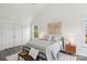 A cozy bedroom has neutral paint, wood-look flooring, a large bed and ample storage at 1986 Trace Creek Dr, Waxhaw, NC 28173