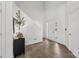 Bright foyer featuring wood-look floors, a black console table, and white walls at 1986 Trace Creek Dr, Waxhaw, NC 28173