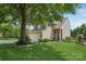 Beautiful two-story home with mature shade tree, manicured lawn, and inviting curb appeal at 1986 Trace Creek Dr, Waxhaw, NC 28173