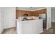 A stylish kitchen with wooden cabinetry, stainless steel appliances, and a bright white countertop at 1986 Trace Creek Dr, Waxhaw, NC 28173