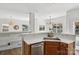 A kitchen with stainless steel sink and faucet, white countertops, and wooden cabinets at 1986 Trace Creek Dr, Waxhaw, NC 28173