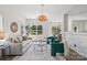 Bright and airy living room with hardwood floors, neutral decor, and easy access to the dining area at 1986 Trace Creek Dr, Waxhaw, NC 28173