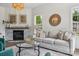 Bright living room with stone fireplace, modern furnishings, and ample natural light at 1986 Trace Creek Dr, Waxhaw, NC 28173