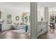 Open-concept living room with hardwood floors, neutral decor, and view into dining area at 1986 Trace Creek Dr, Waxhaw, NC 28173