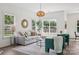 Bright living room with large windows, neutral decor, and stylish lighting at 1986 Trace Creek Dr, Waxhaw, NC 28173