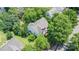 Aerial view of the house shows the roof, backyard and surrounding trees and lawns at 2001 Enderbury Dr, Indian Trail, NC 28079