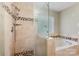 Bright bathroom featuring a tiled shower, soaking tub, and mosaic accents at 2001 Enderbury Dr, Indian Trail, NC 28079