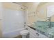 Bathroom featuring a vanity, a shower-tub combo, and tiled accents at 2001 Enderbury Dr, Indian Trail, NC 28079