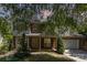 Charming brick and siding two-story home with a well-manicured lawn and a two car garage at 2001 Enderbury Dr, Indian Trail, NC 28079