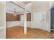Bright foyer and dining room with hardwood floors, wainscoting, and an elegant chandelier at 2001 Enderbury Dr, Indian Trail, NC 28079