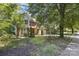 A two-story home with brick and vinyl siding, an attached two car garage and mature landscaping at 2001 Enderbury Dr, Indian Trail, NC 28079
