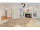 Living room with a stone fireplace, lots of natural light, and access to other rooms at 2001 Enderbury Dr, Indian Trail, NC 28079