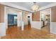 Open-concept with hardwood floors, and views into kitchen, dining room, and secondary room at 2001 Enderbury Dr, Indian Trail, NC 28079