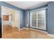 This room features hardwood floors, a large window, and a doorway that leads to another room at 2001 Enderbury Dr, Indian Trail, NC 28079