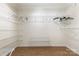 Spacious walk-in closet with ample shelving and rod space for storage at 2001 Enderbury Dr, Indian Trail, NC 28079