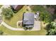 An aerial view displays the roof and surrounding landscaping of the house, plus a driveway and a patio at 205 Rosedale Ln, Matthews, NC 28105