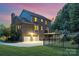 A brick home with a fenced in backyard, two-car garage, patio, and lush green lawn at 205 Rosedale Ln, Matthews, NC 28105