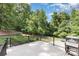 Backyard deck with a grill and lush green landscaping, perfect for outdoor entertaining at 205 Rosedale Ln, Matthews, NC 28105