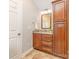 This bathroom offers warm cabinets, a granite countertop and lots of cabinet space at 205 Rosedale Ln, Matthews, NC 28105