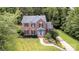 Beautiful front exterior view of a brick home with manicured landscaping and a neatly kept lawn at 205 Rosedale Ln, Matthews, NC 28105