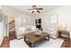 Bright living room with hardwood floors, neutral furniture, and open doorway at 205 Rosedale Ln, Matthews, NC 28105