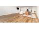 Open concept living area with wood flooring, an accent rug, and an office desk at 205 Rosedale Ln, Matthews, NC 28105