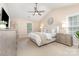 Spacious main bedroom with vaulted ceilings, neutral tones, a ceiling fan, and natural light at 205 Rosedale Ln, Matthews, NC 28105