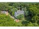 Stunning aerial view of a home nestled in lush greenery, featuring a well-manicured lawn and mature trees at 2324 Kingsmill Ter, Charlotte, NC 28270