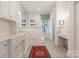 Bathroom with double sink vanity, natural light and neutral colored walls at 2324 Kingsmill Ter, Charlotte, NC 28270