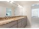 Bathroom featuring granite countertops, stylish fixtures, and vanity with generous storage at 2324 Kingsmill Ter, Charlotte, NC 28270