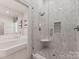 Bathroom featuring glass shower and soaking tub at 2324 Kingsmill Ter, Charlotte, NC 28270