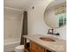 Bathroom features an ornate sink and vintage-style faucet, mirror, toilet, and tiled shower at 2324 Kingsmill Ter, Charlotte, NC 28270