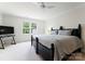 Bright and spacious bedroom with plush carpeting, twin windows, and modern decor at 2324 Kingsmill Ter, Charlotte, NC 28270