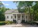 A beautiful white house with a large front porch and columns at 2324 Kingsmill Ter, Charlotte, NC 28270