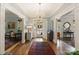 Welcoming foyer featuring hardwood floors and views into adjacent living spaces at 2324 Kingsmill Ter, Charlotte, NC 28270