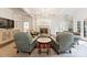 Bright living room featuring a fireplace, modern light fixture, and stylish decor at 2324 Kingsmill Ter, Charlotte, NC 28270