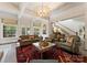 Bright and airy living room showcasing high ceilings and a stylish chandelier at 2324 Kingsmill Ter, Charlotte, NC 28270