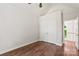 Bedroom with hardwood floors, a ceiling fan, and a closet with double doors at 3011 Mckee Rd, Charlotte, NC 28270