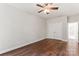 Bedroom with hardwood floors, a ceiling fan, and a closet with double doors at 3011 Mckee Rd, Charlotte, NC 28270