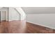 Large bonus room with hardwood floors, recessed lighting, and slanted ceilings at 3011 Mckee Rd, Charlotte, NC 28270