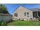 Backyard with a detached garage, some lawn equipment, and various plants and gardening supplies at 3418 York Hwy, Gastonia, NC 28052