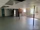 Spacious unfinished basement with painted floor, brick chimney, and natural light at 3484 S Hwy 127 Hwy, Hickory, NC 28602