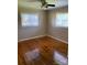 Bedroom with hardwood floors, ceiling fan, and two windows for natural light at 3484 S Hwy 127 Hwy, Hickory, NC 28602
