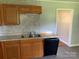 Functional kitchen featuring wood cabinets, laminate countertops and stainless steel sink at 3484 S Hwy 127 Hwy, Hickory, NC 28602