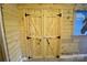 Unique bedroom closet doors featuring faux wood, and black iron hardware at 416 E Union St, Marshville, NC 28103