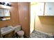 Bathroom with a standard toilet, vanity and shower, all in a compact space at 416 E Union St, Marshville, NC 28103