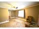 Spacious bedroom with a chair and ottoman at 416 E Union St, Marshville, NC 28103