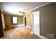 Bedroom with chair, ottoman, window and neutral-colored walls at 416 E Union St, Marshville, NC 28103