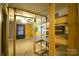 Bedroom with wooden shelving, two tone walls, neutral carpet, and ceiling fan at 416 E Union St, Marshville, NC 28103