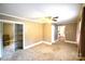 A spacious bedroom featuring neutral walls, carpet, and a closet with mirrored sliding doors at 416 E Union St, Marshville, NC 28103